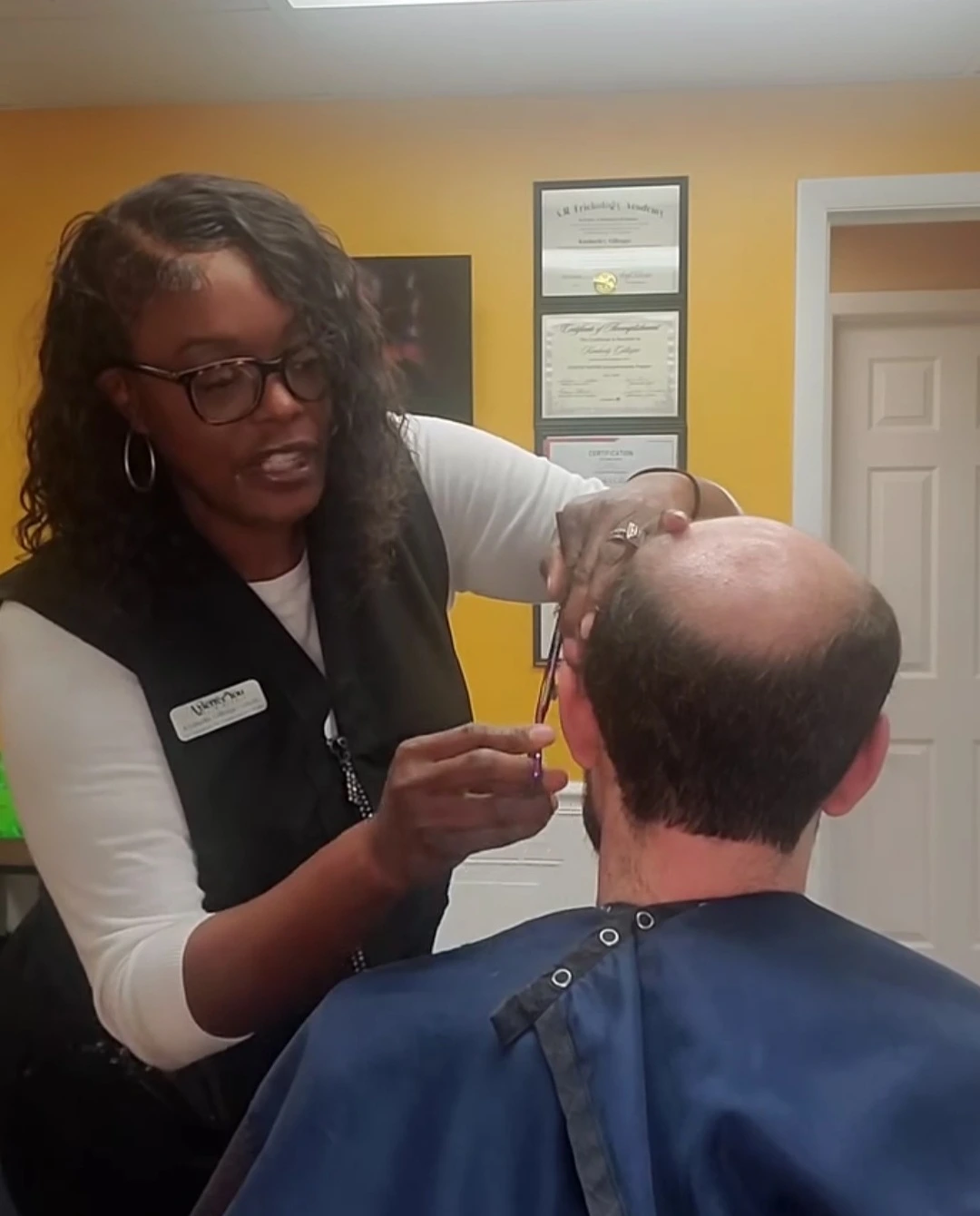 A Better You Hair Studio specialist creating a natural, confident style for a client in Chattanooga TN